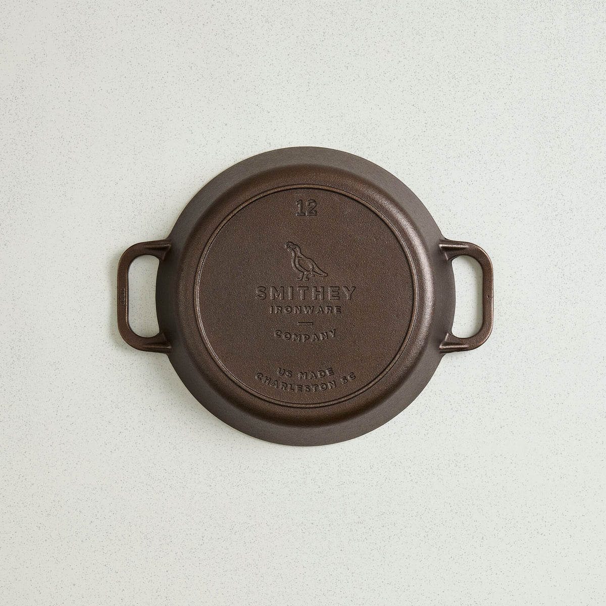 Underside of the No. 12 Dual Handle Skillet showing the cast Smithey logo