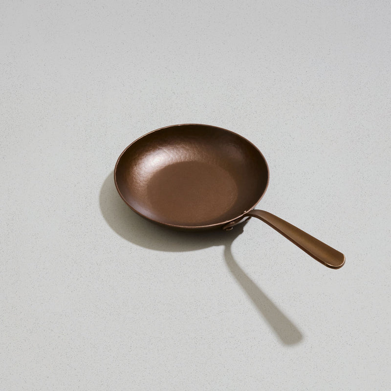 Little Farmhouse Skillet, angled overhead view of the carbon steel cooking surface