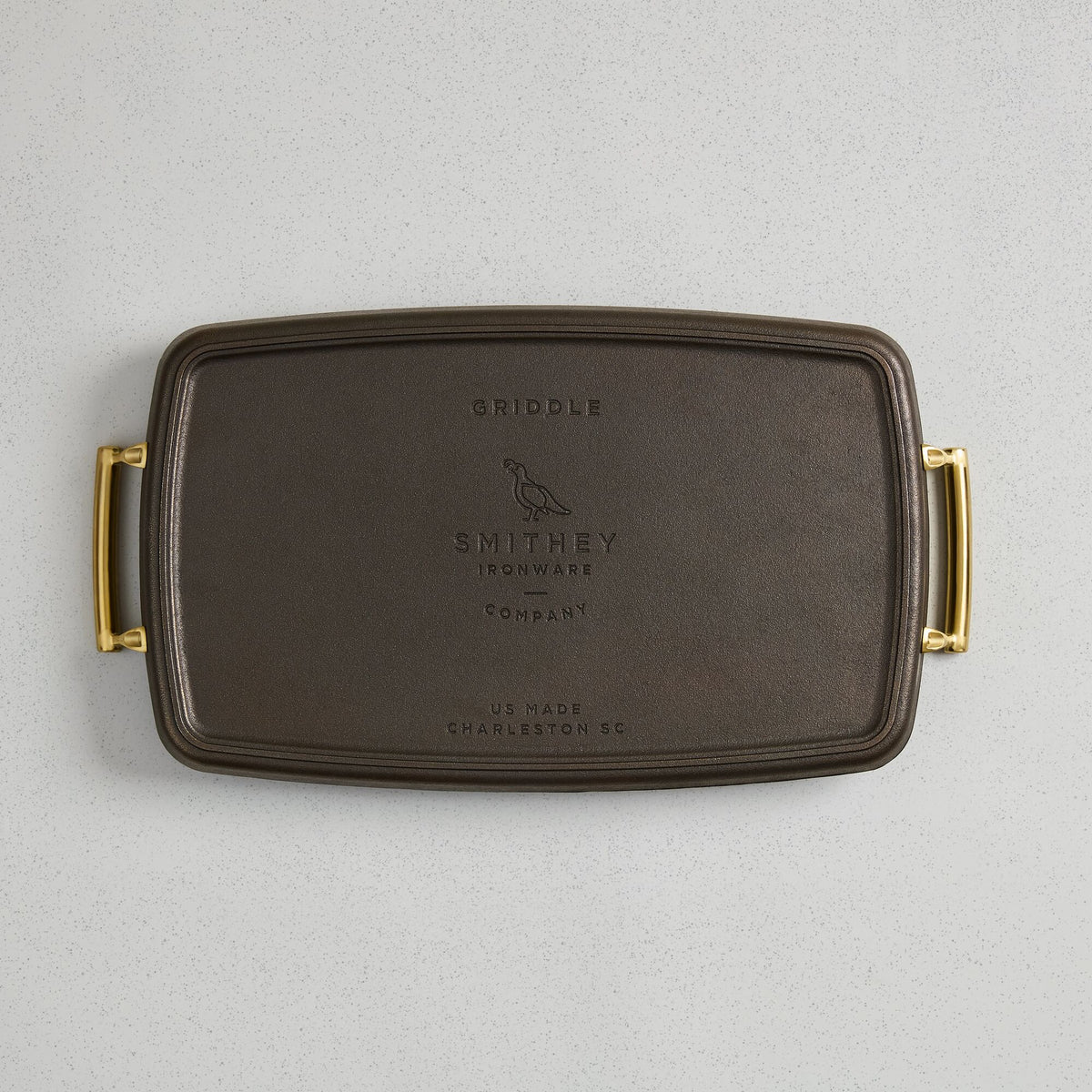 Underside of the Double Burner Griddle showing the cast Smithey logo