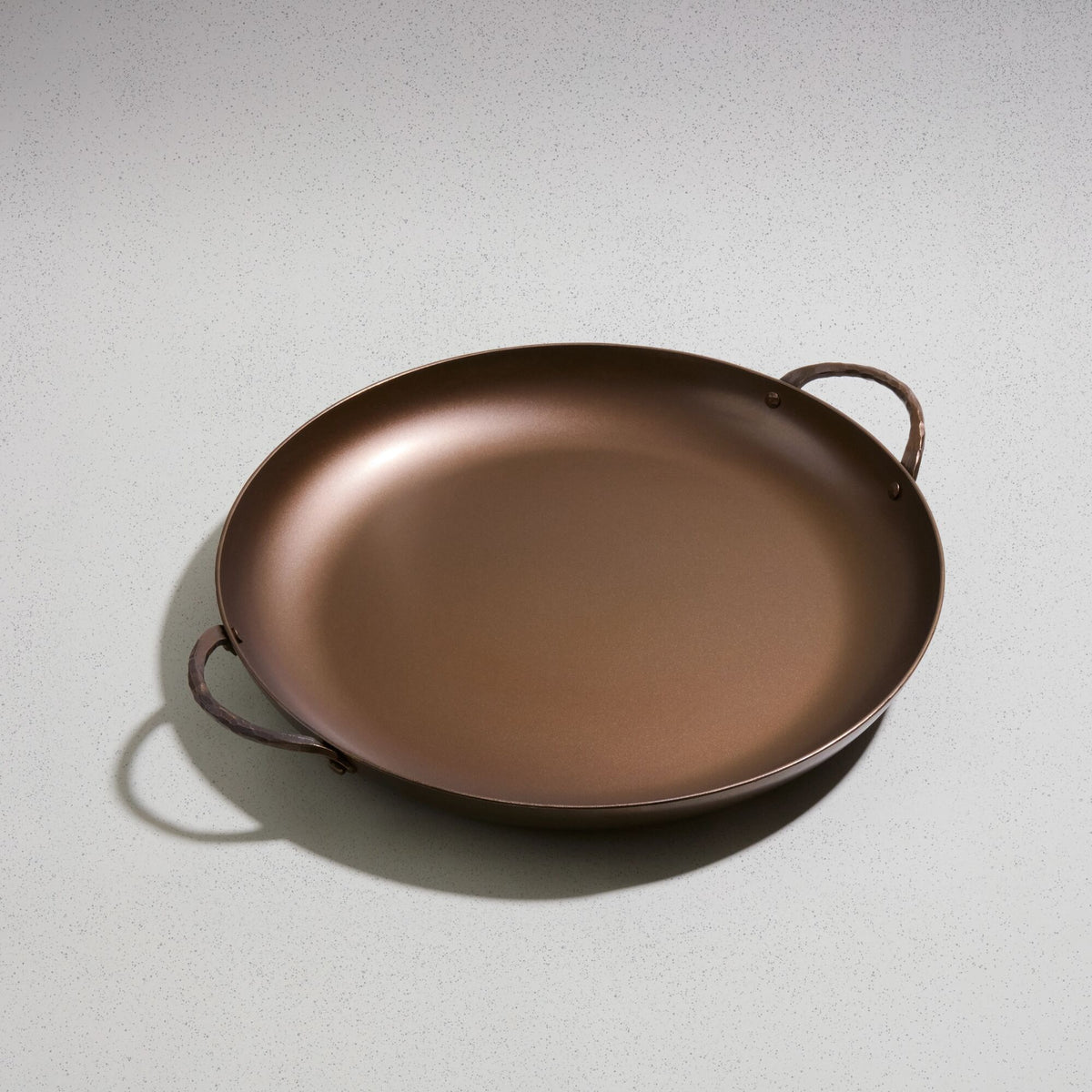 Paella Pan, angled overhead view of the carbon steel cooking surface