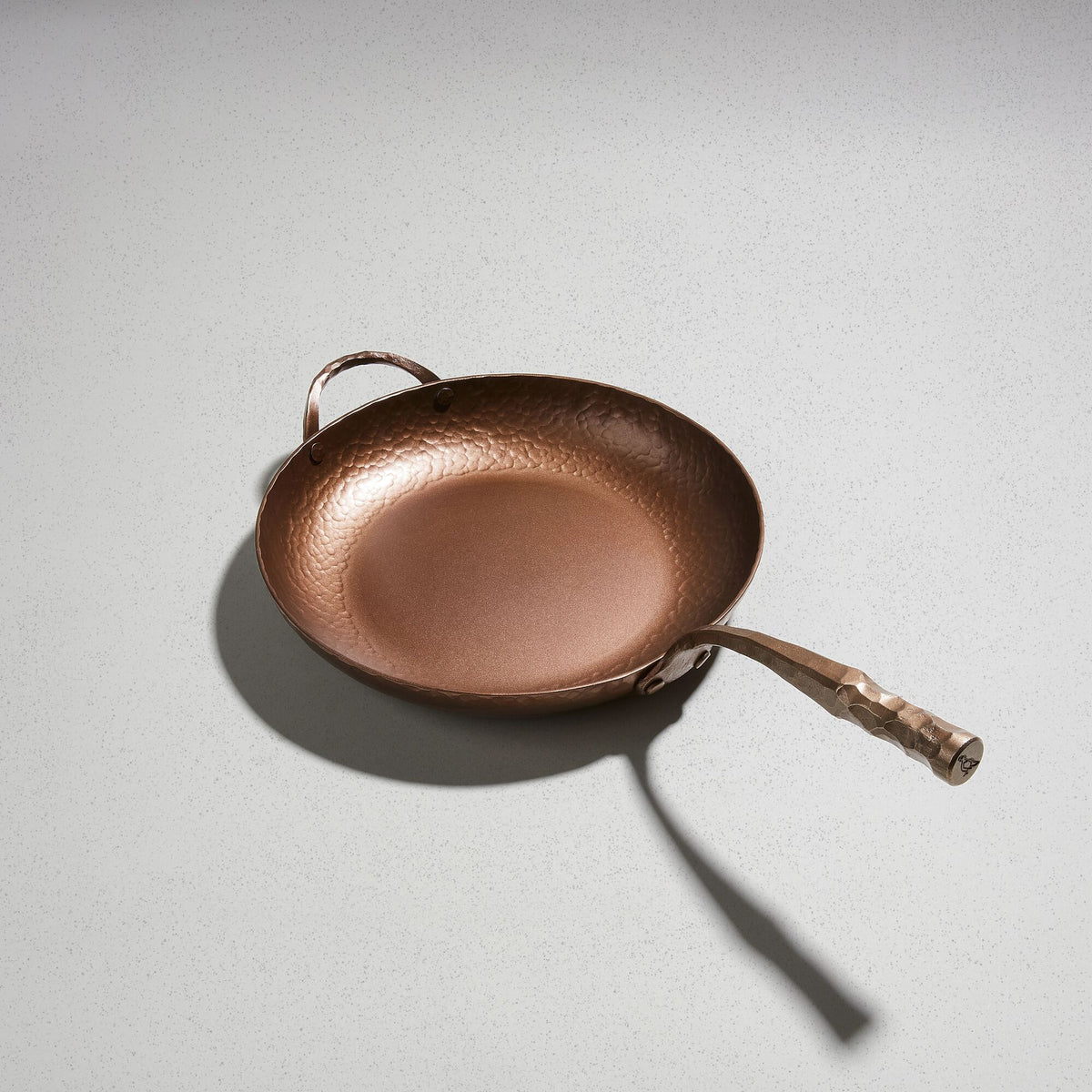 Deep Farmhouse Skillet, angled overhead view of the hand-hammered carbon steel