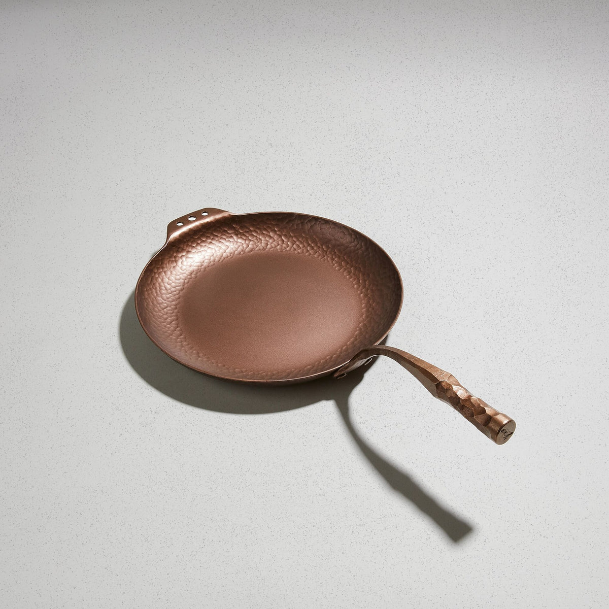 Farmhouse Skillet, angled overhead view of the hand-hammered carbon steel
