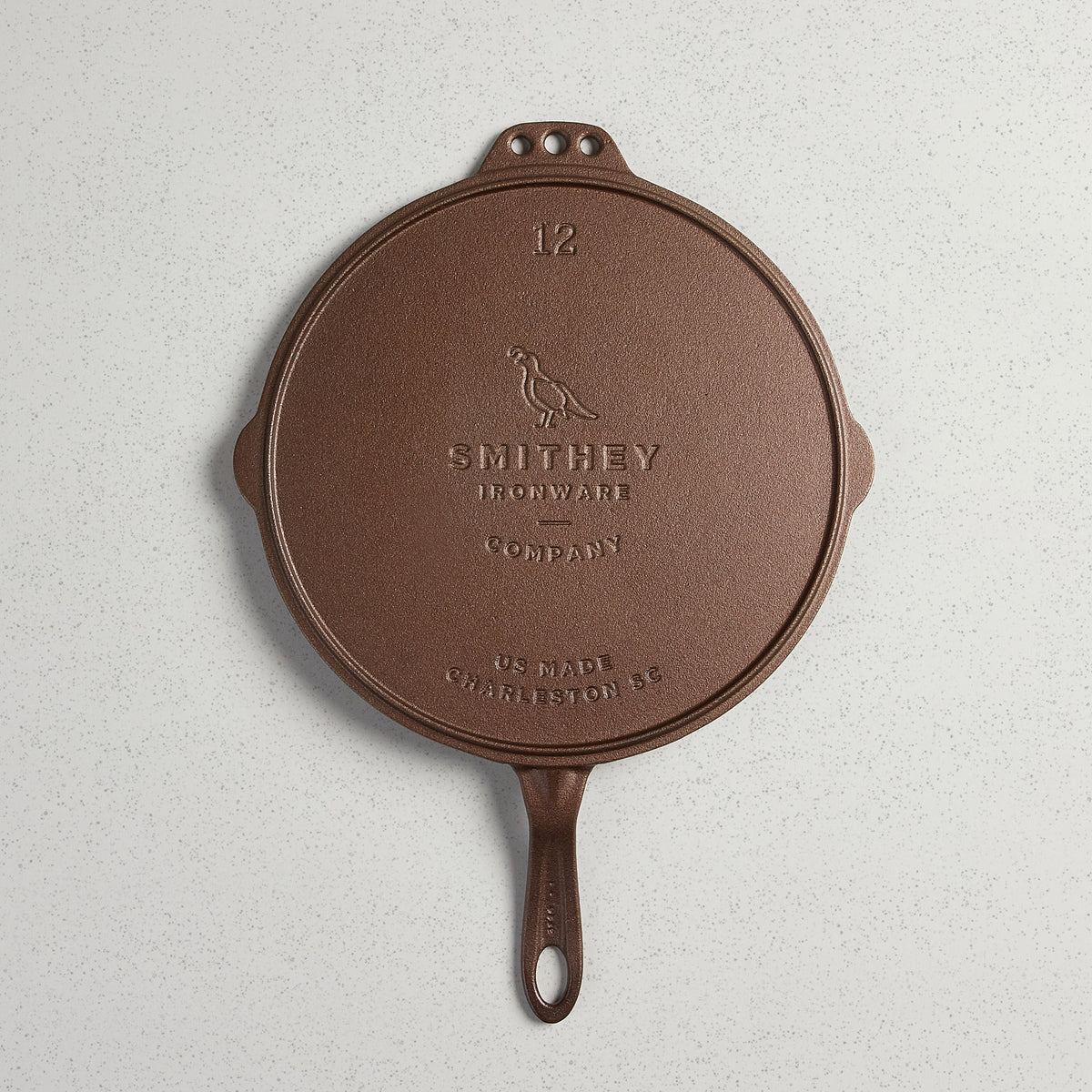 Underside of the No. 12 Flat Top Griddle showing the cast Smithey logo