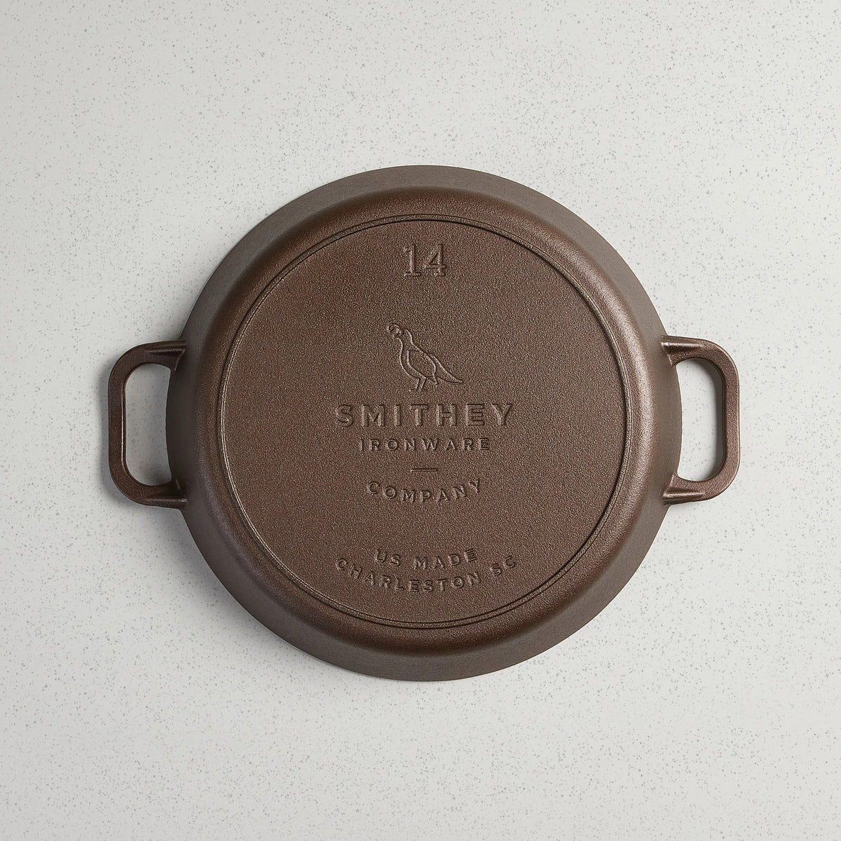 Underside of the No. 14 Dual Handle Skillet showing the cast Smithey logo