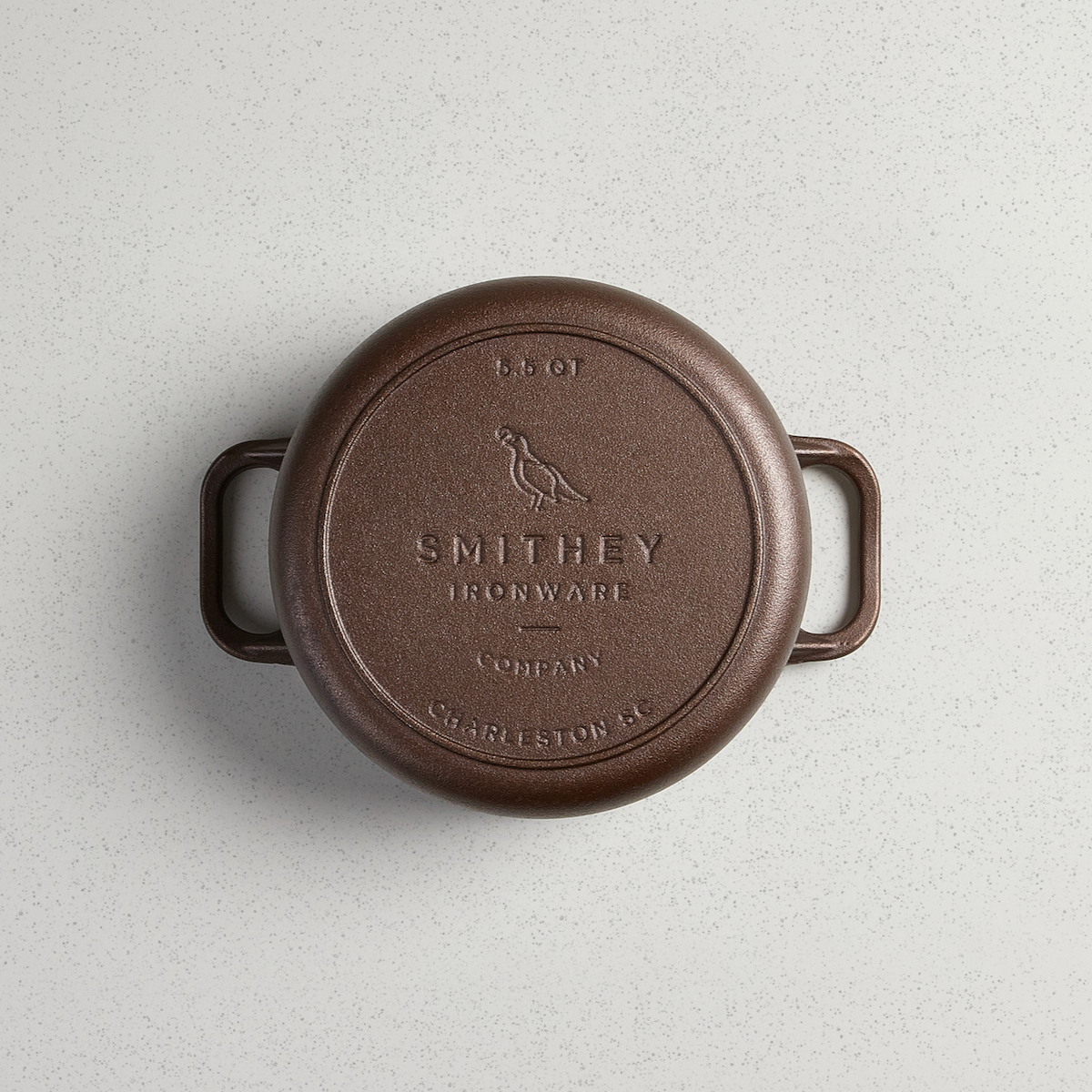Underside of the 5.5 Qt Dutch Oven showing the cast Smithey logo