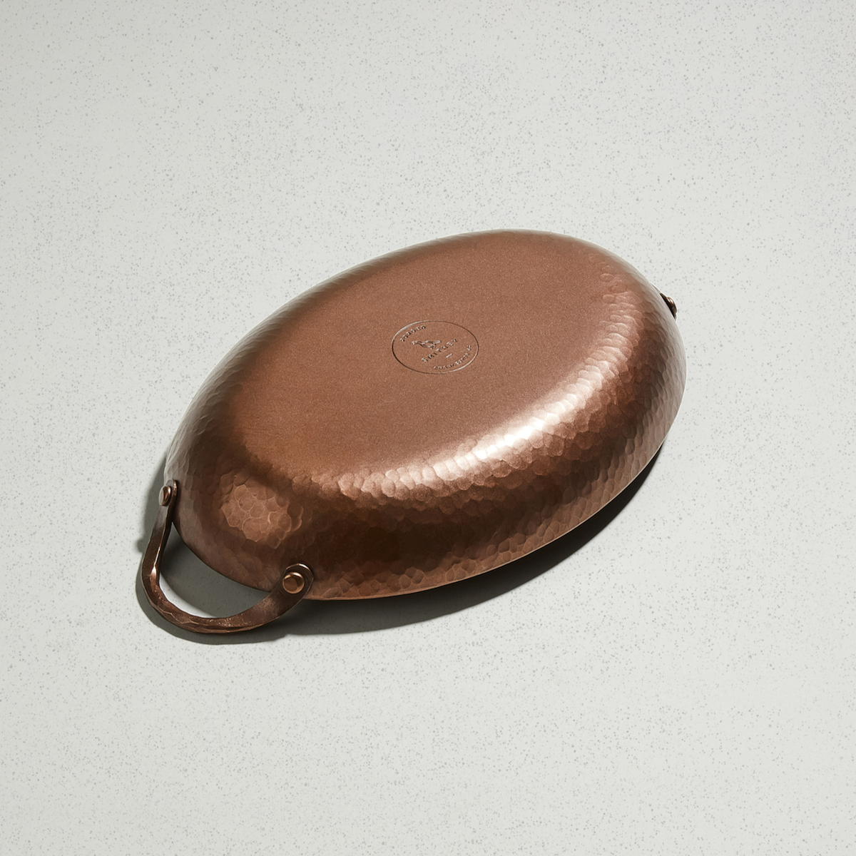 Underside of the Oval Roaster showing the hammered finish and Smithey logo