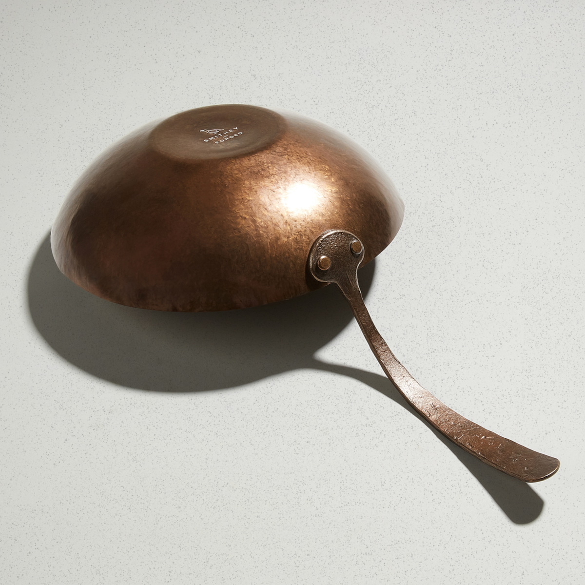 Underside of the Wok showing the hammered finish and Smithey logo