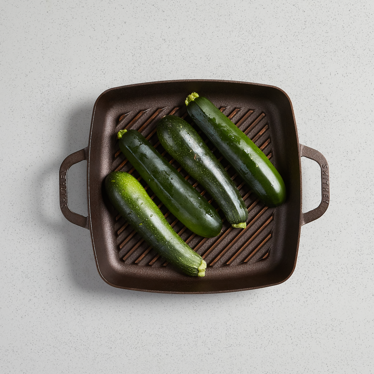 Whole zucchini on a No. 12 Grill Pan, viewed from above