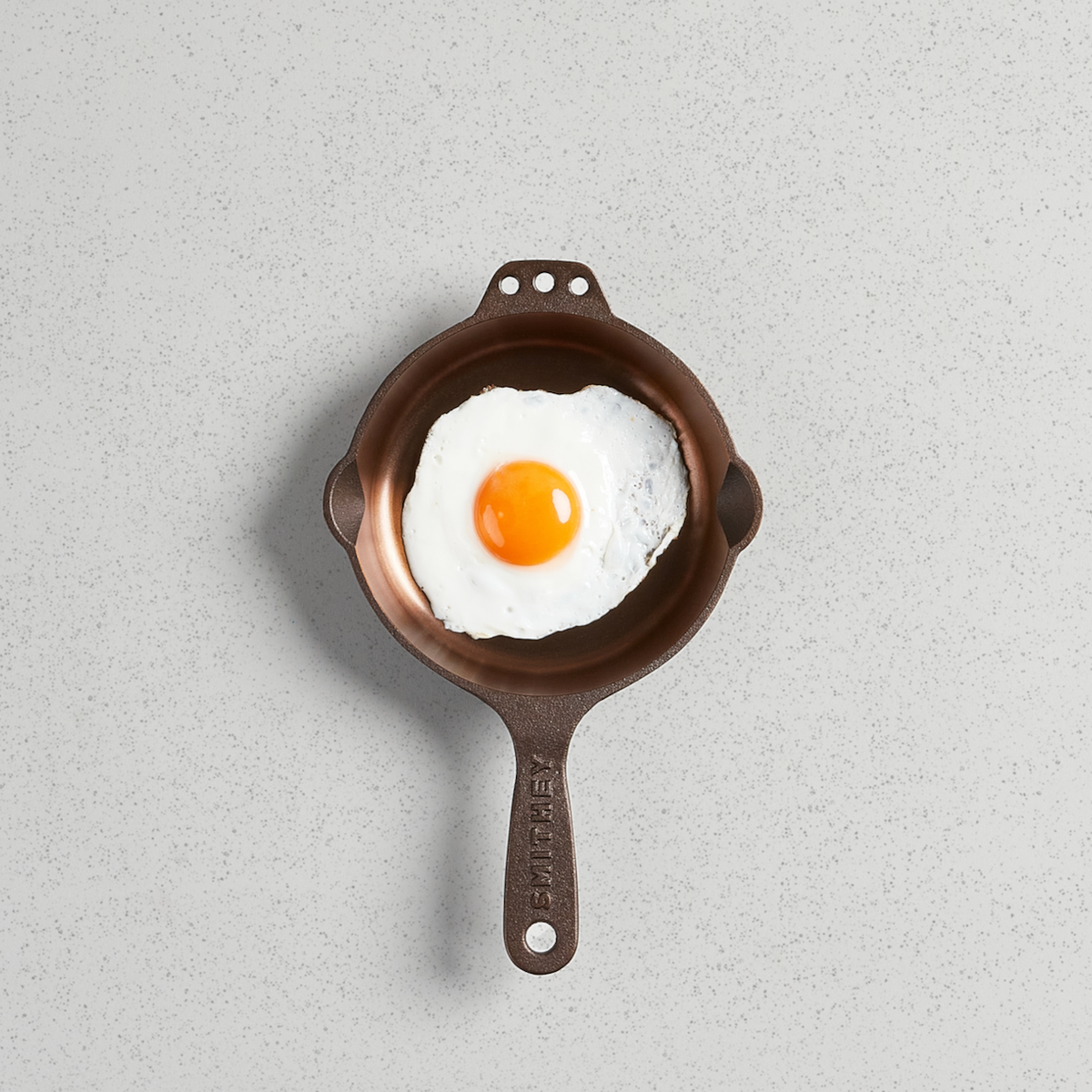 A fried egg in a No. 6 Skillet, viewed from above