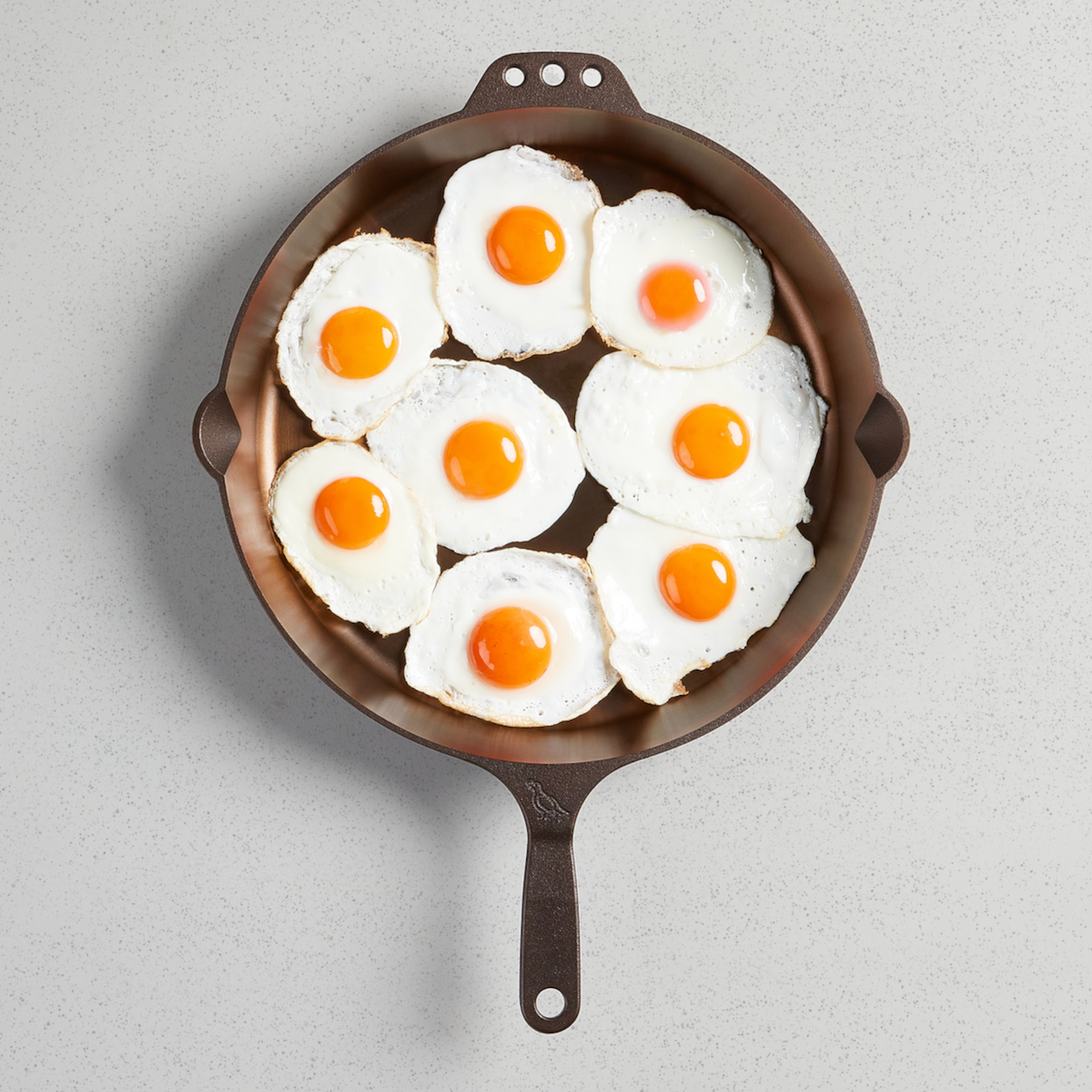 Fried eggs filling a No. 14 Skillet, viewed from above